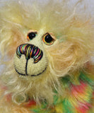 Daffy Doolittle is mostly a very curly and fairly mohair that Barbara has hand dyed in beautiful shades of yellow, green, lime and orange, with colourful faux fur.  Daffy Doolittle has beautiful, hand painted eyes with hand coloured eyelids, a splendid nose embroidered from individual threads to compliment her colouring and she has a huge, friendly smile