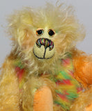 Daffy Doolittle is a very happy and colourful one of a kind, hand dyed mohair and faux fur artist bear by Barbara-Ann Bears, she is 8.5 inches/21 cm tall. Daffy Doolittle is mostly a very curly and fairly mohair that Barbara has hand dyed in beautiful shades of yellow, green, lime and orange, with colourful faux fur.
