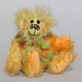Daffy Doolittle is a very happy and colourful one of a kind, hand dyed mohair and faux fur artist bear by Barbara-Ann Bears, she is 8.5 inches/21 cm tall. Daffy Doolittle is mostly a very curly and fairly mohair that Barbara has hand dyed in beautiful shades of yellow, green, lime and orange, with colourful faux fur.
