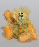 Daffy Doolittle is a very happy and colourful one of a kind, hand dyed mohair and faux fur artist bear by Barbara-Ann Bears, she is 8.5 inches/21 cm tall. Daffy Doolittle is mostly a very curly and fairly mohair that Barbara has hand dyed in beautiful shades of yellow, green, lime and orange, with colourful faux fur.