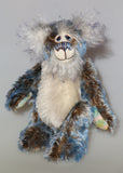 Danny Dalrymple is a very sweet and happy one of a kind, mohair artist bear by Barbara-Ann Bears, he stands 8 inches/20cm tall and is 6.5 inches/17 cm sitting. Danny Dalrymple's main mohair is a very rare, almost vintage, medium length, slightly wavy German mohair that is dark brown with tipping in white and then blue