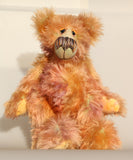 Daphne, a gently romantic and artistic, one of a kind artist bear in gently coloured hand dyed mohair by Barbara Ann Bears, she stands 16 inches/41 cm tall and is 12 inches/31 cm sitting. Daphne is made from a long and luscious, straight pile mohair that Barbara has dyed in subtle blends of dusky fawn, peach and lilac