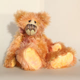 Daphne, a gently romantic and artistic, one of a kind artist bear in gently coloured hand dyed mohair by Barbara Ann Bears, she stands 16 inches/41 cm tall and is 12 inches/31 cm sitting. Daphne is made from a long and luscious, straight pile mohair that Barbara has dyed in subtle blends of dusky fawn, peach and lilac