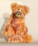 Daphne, a gently romantic and artistic, one of a kind artist bear in gently coloured hand dyed mohair by Barbara Ann Bears, she stands 16 inches/41 cm tall and is 12 inches/31 cm sitting. Daphne is made from a long and luscious, straight pile mohair that Barbara has dyed in subtle blends of dusky fawn, peach and lilac