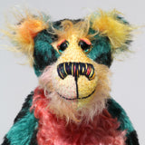 Darcy Dingle has beautiful, hand painted glass eyes with hand coloured eyelids, a splendid nose embroidered from individual threads to compliment his colouring and he has a huge, friendly smile. Darcy Dingle is the happiest of teddy bears, a bear who wants to brighten every dark corner and bring smiles and laughter wherever he goes