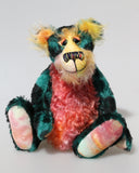Darcy Dingle is a wild and wonderful bear, full of colourful happiness, a one of a kind, mohair artist teddy bear by Barbara-Ann Bears Darcy Dingle stands 10 inches( 25 cm) tall and is 8 inches ( 20 cm) sitting.
