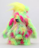 Dazzling Dave is a flamboyant fun-loving and comical, one of a kind, artist bear by Barbara-Ann Bears, he stands 13 inches/33 cm tall and is 10.5 inches/27 cm sitting. He is made of bright lime, pink, yellow and lavender faux fur, with lime paw pads, hand painted eyes, a beautiful multi coloured nose and a sweet smile