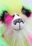 Dazzling Dave is a flamboyant fun-loving and comical, one of a kind, artist bear by Barbara-Ann Bears, he stands 13 inches/33 cm tall and is 10.5 inches/27 cm sitting. He is made of bright lime, pink, yellow and lavender faux fur, with lime paw pads, hand painted eyes, a beautiful multi coloured nose and a sweet smile
