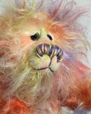 Dear Prudence, a bright and friendly, one of a kind, artist teddy bear by Barbara-Ann Bears, she stands 8.5 inches( 21 cm) tall and is 6.5 inches ( 16 cm) sitting.  Dear Prudence is made from a very long and twirly mohair that Barbara has dyed in oranges, greens, blues, reds, yellows, maroons, purples and lilacs