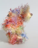 Dear Prudence, a bright and friendly, one of a kind, artist teddy bear by Barbara-Ann Bears, she stands 8.5 inches( 21 cm) tall and is 6.5 inches ( 16 cm) sitting.  Dear Prudence is made from a very long and twirly mohair that Barbara has dyed in oranges, greens, blues, reds, yellows, maroons, purples and lilacs