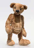 Eustace is a very lovable and sweet, one of a kind, traditional artist teddy bear made from gorgeous vintage mohair by Barbara-Ann Bears. Eustace stands 8 inches (20 cm) tall and is 6 inches (15 cm) sitting. Eustace is made from beige vintage German mohair with a faint design in red, with boot button eyes