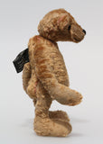 Eustace is a very lovable and sweet, one of a kind, traditional artist teddy bear made from gorgeous vintage mohair by Barbara-Ann Bears. Eustace stands 8 inches (20 cm) tall and is 6 inches (15 cm) sitting. Eustace is made from beige vintage German mohair with a faint design in red, with boot button eyes