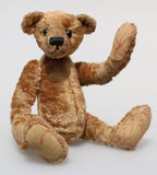 Eustace is a very lovable and sweet, one of a kind, traditional artist teddy bear made from gorgeous vintage mohair by Barbara-Ann Bears. Eustace stands 8 inches (20 cm) tall and is 6 inches (15 cm) sitting. Eustace is made from beige vintage German mohair with a faint design in red, with boot button eyes