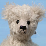 Fairbrother is a sweet and gentle, one of a kind, traditional artist teddy bear made from beautiful German mohair, by Barbara-Ann Bears Fairbrother stands 12 inches (30cm) tall and is 9 inches (23cm) sitting Fairbrother is made from beautiful, slightly wavy, silver German mohair which has a hint of lilac in the backing