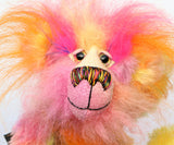Wowzer is an extremely cheerful multi-coloured bear, a bear of beautiful, vivid, spicy colours