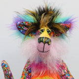 Faustus has large, beautiful, glass eyes which have been painted in gentle shades of green (like a cat's eyes) and these have hand coloured eyelids. She has an impressive nose embroidered from individual threads to match his colours and a quizzical smile