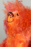 Flamin' Frizz has hand painted glass eyes with hand coloured eyelids. He has a carefully embroidered nose, sewn from individual threads to match the colouring of his mohair, and a warm beaming smile which gives him that puppy dog 'please pick me up and love me' expression