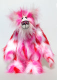 Francisco is a gloriously pink, fun-loving and comical, one of a kind artist bear by Barbara-Ann Bears in luxurious mohair and rather wild faux fur, he stands 14.5 inches/37 cm tall. Francisco is made from long, fluffy faux fur with patches of magenta, baby pink, scarlet and white, coupled with a long white mohair.