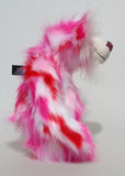 Francisco is a gloriously pink, fun-loving and comical, one of a kind artist bear by Barbara-Ann Bears in luxurious mohair and rather wild faux fur, he stands 14.5 inches/37 cm tall. Francisco is made from long, fluffy faux fur with patches of magenta, baby pink, scarlet and white, coupled with a long white mohair.