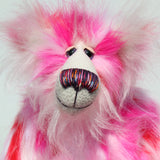 Francisco is made from long, fluffy faux fur with patches of magenta, baby pink, scarlet and white, coupled with a long white mohair. Francisco has beautiful hand painted glass eyes with eyelids, a wonderfully embroidered nose, sewn from individual threads to match his colouring and he has a huge beaming smile
