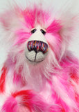 Francisco is made from long, fluffy faux fur with patches of magenta, baby pink, scarlet and white, coupled with a long white mohair. Francisco has beautiful hand painted glass eyes with eyelids, a wonderfully embroidered nose, sewn from individual threads to match his colouring and he has a huge beaming smile