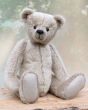 Frederick is a very sweet and cuddly, traditional teddy bear by Barbara Ann Bears, he stands 15.5 inches (39cm) tall and is 11.5 inches (29cm) sitting. Frederick is made from a silvery-grey German mohair with a straight, fairly short pile and a soft brown backing he has grey wool felt paws and vintage boot buttons eyes
