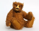 Garth is a very sweet and cuddly, artist teddy bear by Barbara Ann Bears in wonderful chocolate brown mohair, he stands 11 inches/28 cm tall and is 8.5 inches/21 cm sitting. Garth is made from a beautiful, slightly distressed brown German mohair with matching German wool-felt paw pads and small amber glass eyes