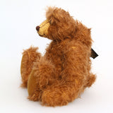 Garth is a very sweet and cuddly, artist teddy bear by Barbara Ann Bears in wonderful chocolate brown mohair, he stands 11 inches/28 cm tall and is 8.5 inches/21 cm sitting. Garth is made from a beautiful, slightly distressed brown German mohair with matching German wool-felt paw pads and small amber glass eyes