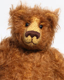 Garth is a very sweet and cuddly, artist teddy bear by Barbara Ann Bears in wonderful chocolate brown mohair, he stands 11 inches/28 cm tall and is 8.5 inches/21 cm sitting. Garth is made from a beautiful, slightly distressed brown German mohair with matching German wool-felt paw pads and small amber glass eyes