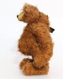Garth is a very sweet and cuddly, artist teddy bear by Barbara Ann Bears in wonderful chocolate brown mohair, he stands 11 inches/28 cm tall and is 8.5 inches/21 cm sitting. Garth is made from a beautiful, slightly distressed brown German mohair with matching German wool-felt paw pads and small amber glass eyes