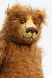 Garth is a very sweet and cuddly, artist teddy bear by Barbara Ann Bears in wonderful chocolate brown mohair, he stands 11 inches/28 cm tall and is 8.5 inches/21 cm sitting. Garth is made from a beautiful, slightly distressed brown German mohair with matching German wool-felt paw pads and small amber glass eyes