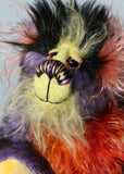 Geoffrey Sniggers has beautiful, hand painted eyes with eyelids, a splendid nose embroidered from individual threads to compliment his colouring and he has a sweet, friendly smileand on top of his head, Geoffrey has a fairly long and dense black faux fur from which plumes of very long orange, violet, magenta and yellow faux fur emerge, a bit like fireworks