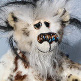 Great Scott has beautiful hand painted slightly sparkling glass eyes (they were painted to complement his colouring) with eyelids, a wonderful nose embroidered with individual threads, also to complement his colouring and a cheeky smile