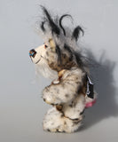 Great Scott is a little, endearingly sweet one of a kind, artist bear by Barbara-Ann Bears in fluffy mohair and wonderful faux fur. He stands just 6 inches/15 cm tall and is 5 inches/18 cm sitting. He is made from dense spotty faux fur with long black plumes of faux fur around his head and a little spotty pink tail.