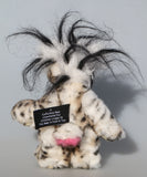 Great Scott is a little, endearingly sweet one of a kind, artist bear by Barbara-Ann Bears in fluffy mohair and wonderful faux fur. He stands just 6 inches/15 cm tall and is 5 inches/18 cm sitting. He is made from dense spotty faux fur with long black plumes of faux fur around his head and a little spotty pink tail.