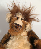 Grooble has beautiful hand painted slightly sparkling glass eyes (they were painted to match his mohair) with eyelids, a wonderfully embroidered nose, sewn from individual threads to match his mohair and an endearing slightly wonky smile, as if he's chewing something.