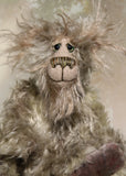 Herbie Hedgerow is a gentle, beautifully coloured one of a kind mohair artist bear by Barbara-Ann Bears, he stands 10 inches/25 cm tall and is 8 inches/20 cm sitting. Herbie Hedgerow is mainly made from a long, fluffy, distressed pale greyish-green mohair coupled with long and fluffy pale grey mohair and hand-dyed velvet paw pads. Herbie has hand painted eyes with eyelids, a carefully embroidered nose and he a sweet, friendly smile