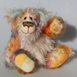 Herbie is a sweet and beautifully coloured one of a kind teddy bear in hand dyed mohair by Barbara-Ann Bears, he stands 10 inches/25 cm tall and is 7.5 inches/19 cm sitting.  Herbie is made from the most gorgeous mohairs, mainly a fairly long tousled mohair hand-dyed in a subtle blend of natural colours