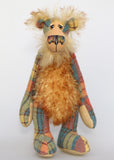Howard Huckleford is an engagingly eccentric one of a kind artist bear in elegant tweed and wildly fluffy tipped mohair by Barbara Ann Bears He stands 14.5 inches( 37 cm) tall and is 11 inches (28 cm) sitting. Howard Huckleford is made from a beautifully coloured Harris Tweed and long, fluffy brown tipped blonde mohair