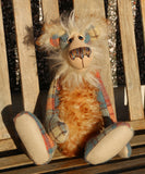 Howard Huckleford is made from a beautifully coloured Harris Tweed and a long, fluffy brown tipped blonde mohair with beige German wool felt paw pads  Howard Huckleford has large, beautiful, hand painted glass eyes (painted to match his colours) with hand coloured eyelids, an impressive nose embroidered from individual threads to match his colouring and a beaming smile