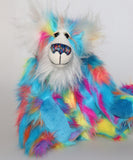 Pedro Piccolo is a humorous and colourful one of a kind artist bear in hand dyed mohair and faux fur by Barbara Ann Bears, he stands 14.5 inches/37 cm tall and is 11 inches/28 cm sitting. He is made from a long and fluffy faux fur in sky blue, yellow, magenta, orange and mauve and a long and fluffy white mohair.