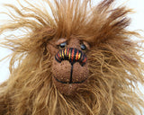 Bruce McCubbin has small Austrian glass eyes, we've had these a very long time, the company that made them also made eyes for taxidermy and these are the same design as their buzzard eyes. He has a pert little nose embroidered from individual threads of fine perle cotton and he has a beaming smile,