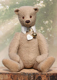 Pomeroy a large and elegant classical, one of a kind, traditional mohair artist teddy bear by Barbara Ann Bears. He stands 23.5 inches (60 cm) tall and is made from gorgeous dense and curly beige mohair with beige suedette paw pads, old amber glass eyes, an impressive embroidered brown nose and the sweetest smile