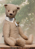 Pomeroy a large and elegant classical, one of a kind, traditional mohair artist teddy bear by Barbara Ann Bears. He stands 23.5 inches (60 cm) tall and is made from gorgeous dense and curly beige mohair with beige suedette paw pads, old amber glass eyes, an impressive embroidered brown nose and the sweetest smile