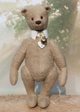 Pomeroy a large and elegant classical, one of a kind, traditional mohair artist teddy bear by Barbara Ann Bears. He stands 23.5 inches (60 cm) tall and is made from gorgeous dense and curly beige mohair with beige suedette paw pads, old amber glass eyes, an impressive embroidered brown nose and the sweetest smile