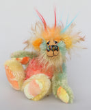 Salsa Verde is a very happy and colourful little one of a kind, hand dyed mohair and faux fur artist bear by Barbara-Ann Bears, he stands 6.5 inches/16 cm tall. Salsa Verde is made from hand dyed mohair, with long plumes of faux fur on his head, hand painted eyes, a multicoloured nose and a beaming smile, a happy bear!