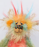 Salsa Verde is a very happy and colourful little one of a kind, hand dyed mohair and faux fur artist bear by Barbara-Ann Bears, he stands 6.5 inches/16 cm tall. Salsa Verde is made from hand dyed mohair, with long plumes of faux fur on his head, hand painted eyes, a multicoloured nose and a beaming smile, a happy bear!