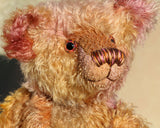 Thomas Muldoon, a traditional, one of a kind artist teddy bear, in fabulous hand dyed mohair by Barbara Ann Bears, he stands 15 inches/38cm tall and is 10.5 inches/27cm sitting. He's made from German mohair hand-dyed in many natural shades, there are several shades of copper, cinnamon, beige, gold, rose and magenta