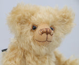 Walter is made from gorgeous dense, wavy, blonde German mohair and coordinating beige wool felt paw pads. Walter has gently coloured and painted eyes, a pert little nose carefully embroidered from a muted blend of brown and beige threads and the sweetest smile