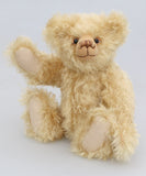 Duncan a one of a kind, traditional mohair artist teddy bear by Barbara-Ann Bears. He stands 11 inches (28cm) tall and is 8 inches (20cm) sitting. He is made from a dense wavy blonde German mohair with wool felt paw pads.  Walter is from the design we used to make Marigold's teddy bear for the TV series Downton